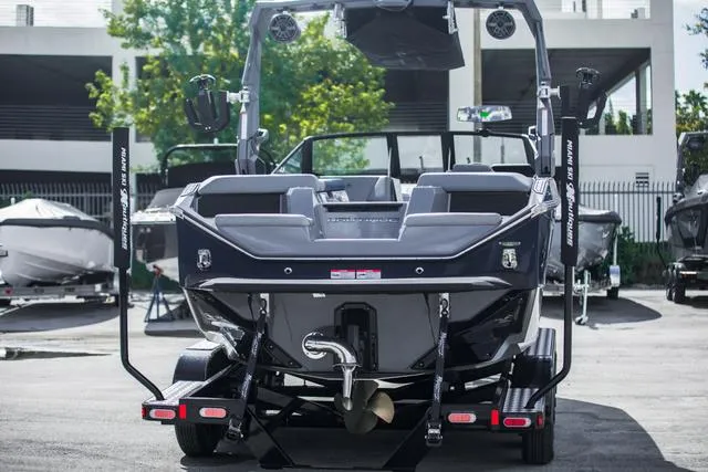 Slide: The Image of 2024 Nautique S23 boat rear view, showcasing sleek design and modern features. - 7