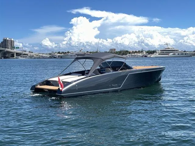 Slide: The Image of 2020 Frauscher 1017GT luxury boat on calm water with clear sky background. - 10