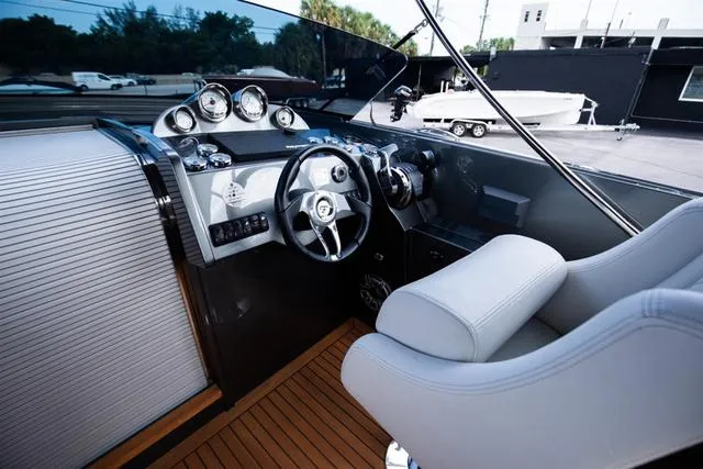 Slide: The Image of 2020 Frauscher 1017GT boat cockpit with modern steering and instrument panel. - 11