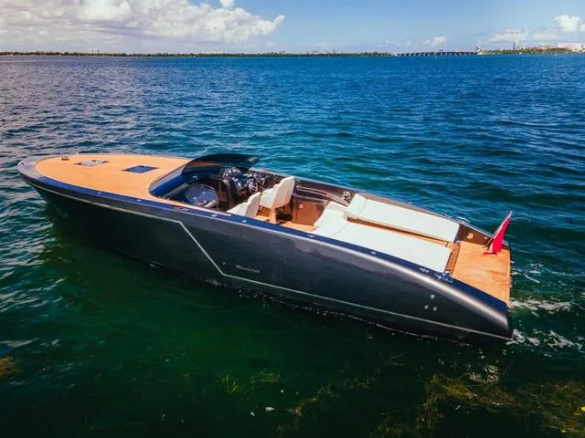 Slide: The Image of 2020 Frauscher 1017GT luxury boat on open water, sleek design, sunny day. - 8
