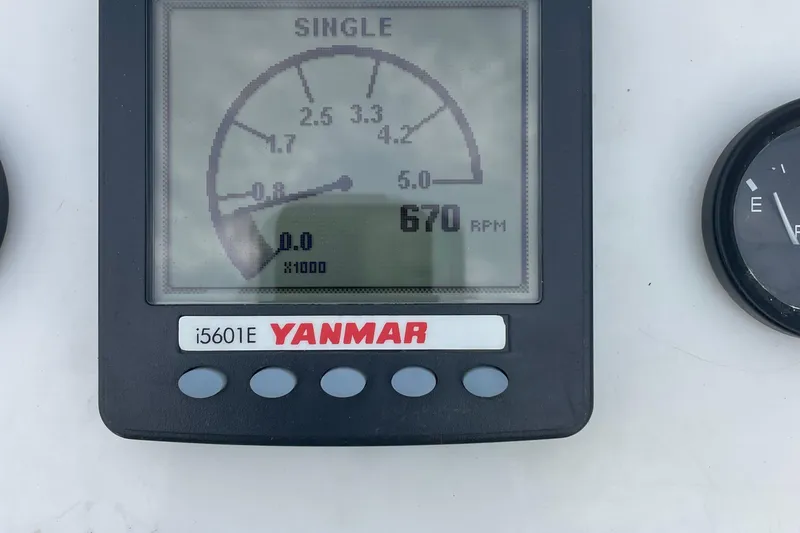 Slide: The Image of Yanmar i5601E engine display showing 670 RPM on a Tripp Angler 22 boat. - 11