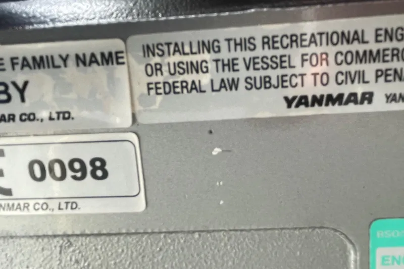 Slide: The Image of Yanmar engine warning label on 1993 Tripp Angler 22 boat. - 13