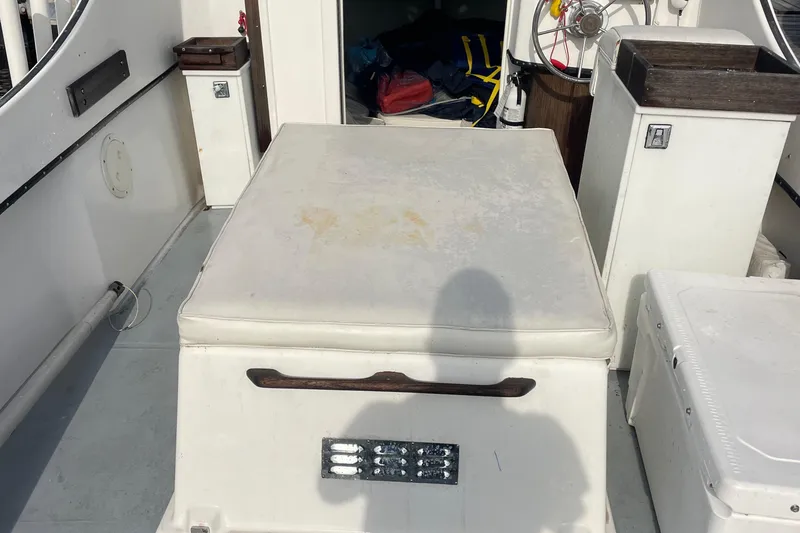 Slide: The Image of 1993 Tripp Angler 22 boat interior with seating and storage compartments. - 5