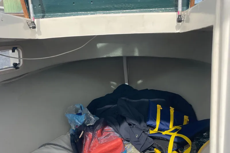 Slide: The Image of Interior of 1993 Tripp Angler 22 boat with gear and supplies. - 6