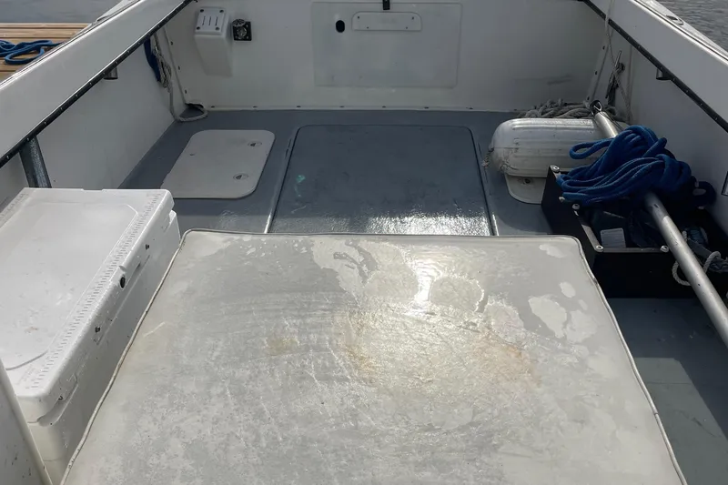 Slide: The Image of 1993 Tripp Angler 22 boat interior with storage compartments and equipment. - 7