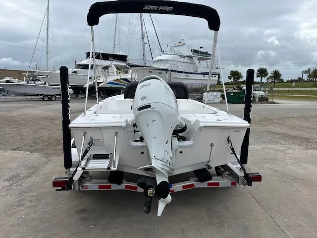 Slide: The Image of 2025 Sea Pro 172 Bay boat on trailer, marina background. - 3