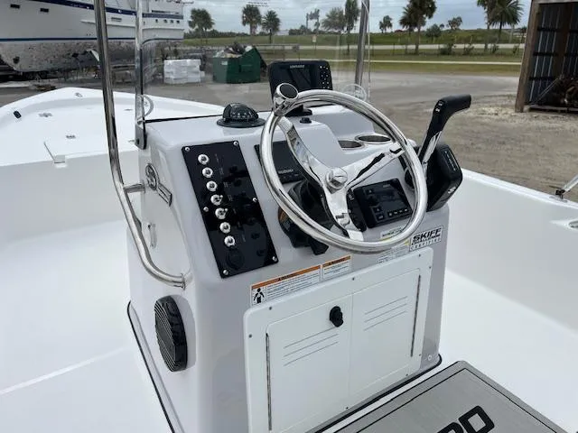 Slide: The Image of 2025 Sea Pro 172 Bay boat console with steering wheel and controls. - 4