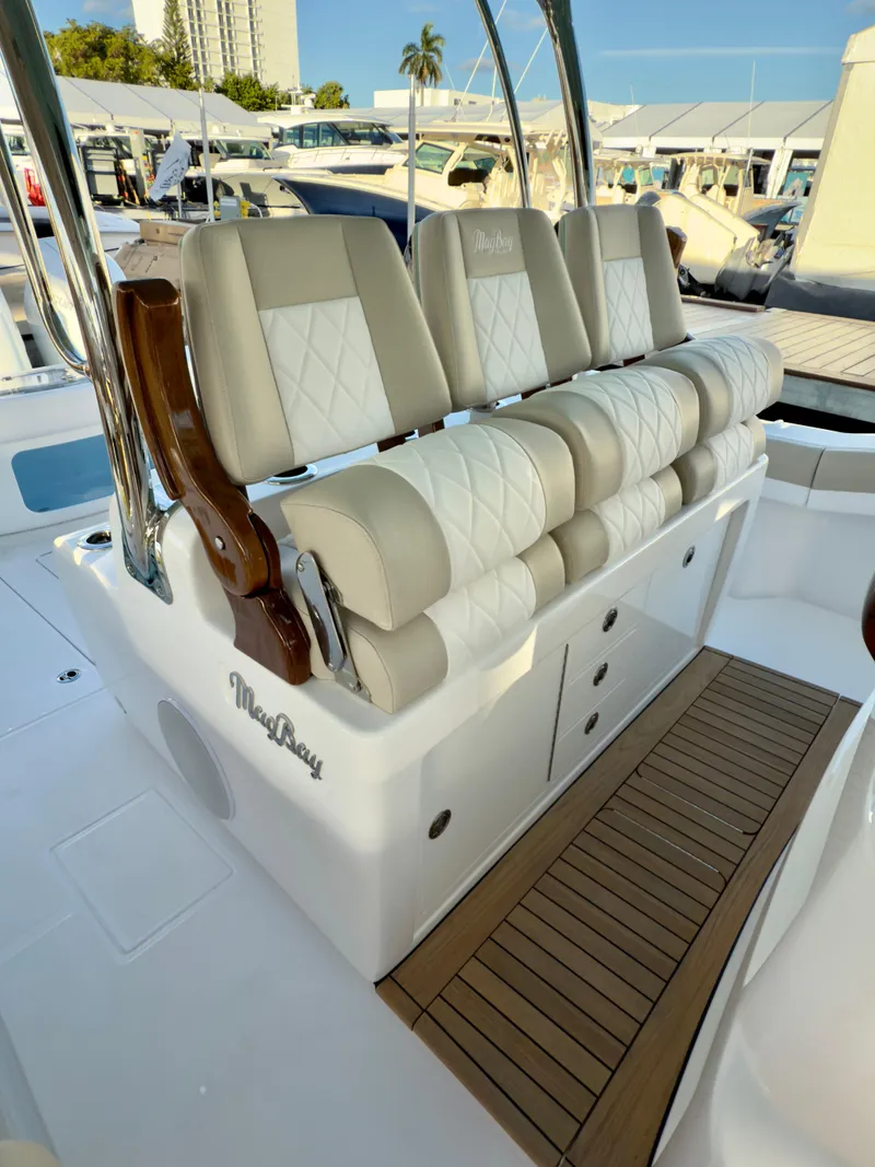 Slide: The Image of 2025 Mag Bay 38 CC boat with luxurious seating and sleek design. - 12