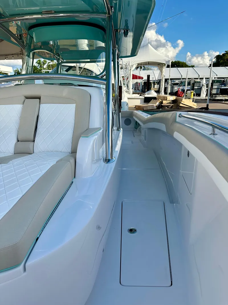 Slide: The Image of 2025 Mag Bay 38 CC boat with luxurious seating and sleek design. - 15