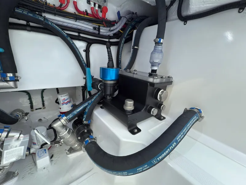 Slide: The Image of Engine compartment of 2025 Mag Bay 38 CC with hoses and components. - 26