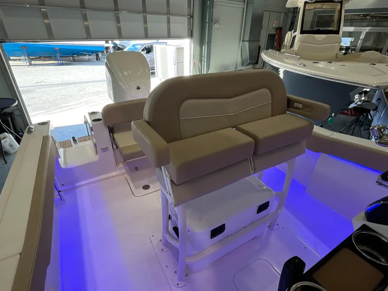 Slide: The Image of 2025 Scout 240 XSF boat interior with illuminated seating and modern design. - 12