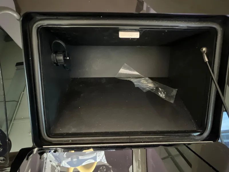 Slide: The Image of Open storage compartment in 2025 Scout 240 XSF boat. - 19