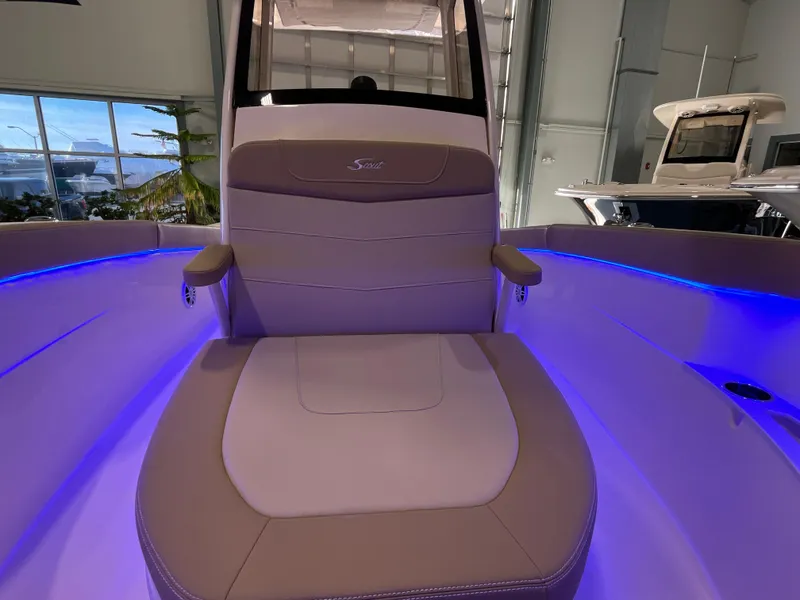 Slide: The Image of Luxurious seating on 2025 Scout 240 XSF boat with ambient blue lighting. - 21