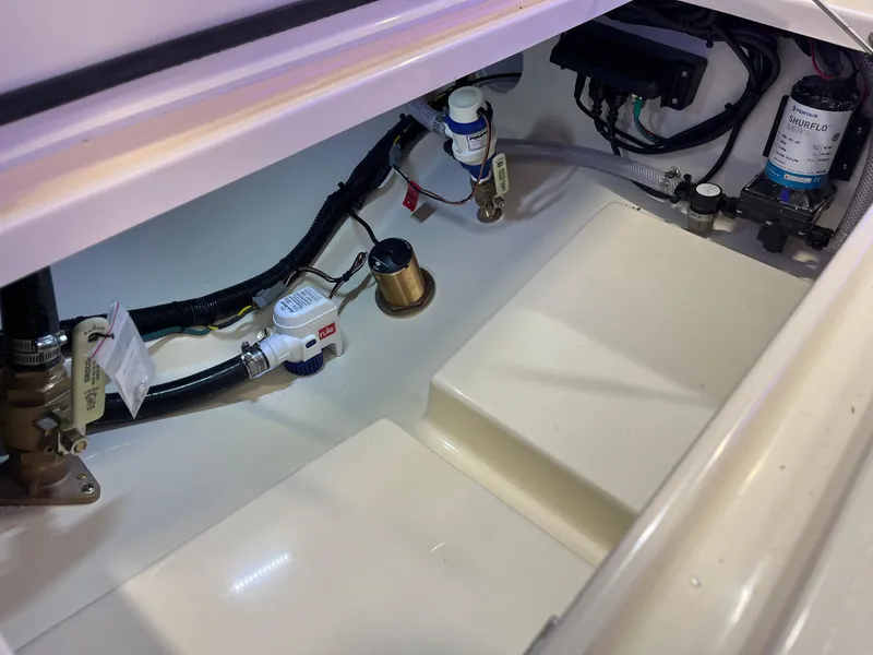 Slide: The Image of 2025 Scout 240 XSF boat interior wiring and components. - 24