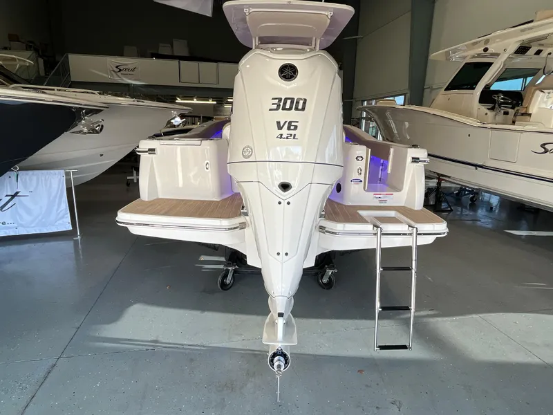 Slide: The Image of 2025 Scout 240 XSF boat with 300 V6 engine in showroom. - 6