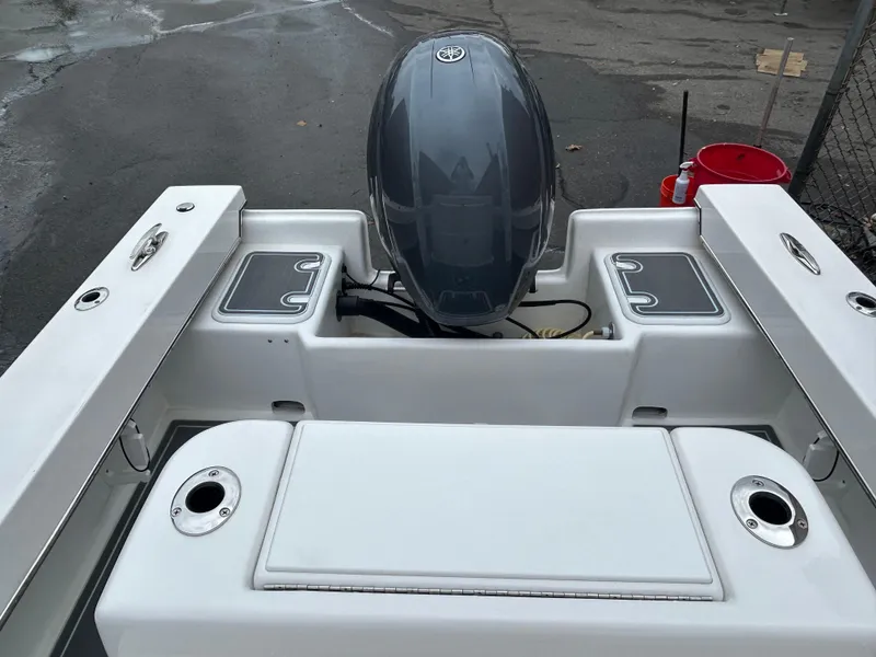 Slide: The Image of 2023 Jones Brothers 23 Cape Fisherman boat with outboard motor, rear view. - 15