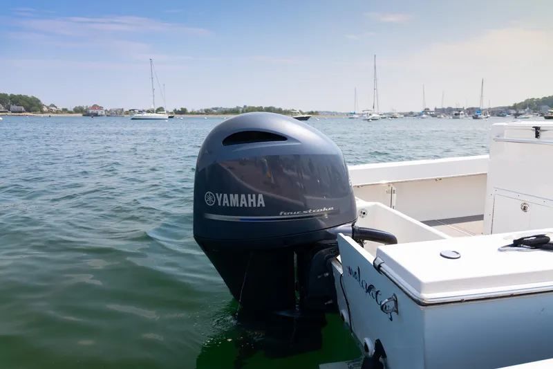 Slide: The Image of Jones Brothers 23 Cape Fisherman boat with Yamaha outboard motor on a sunny day. - 20