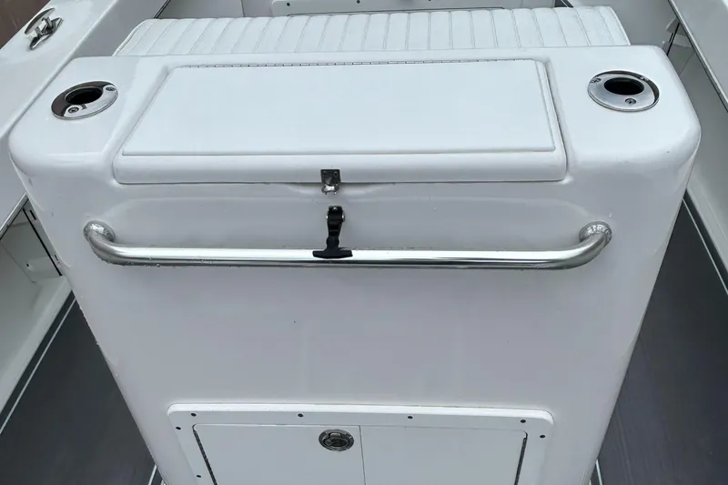 Slide: The Image of 2023 Jones Brothers 23 Cape Fisherman boat console with storage and rod holders. - 21