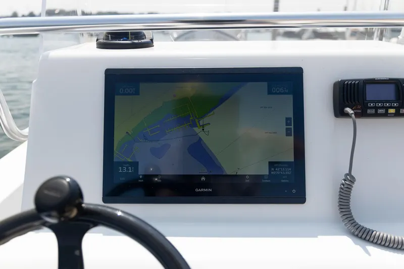Slide: The Image of Dashboard of 2023 Jones Brothers 23 Cape Fisherman with Garmin navigation display. - 26