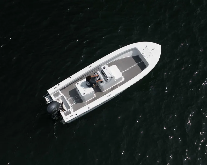 Slide: The Image of 2023 Jones Brothers 23 Cape Fisherman boat on dark water, aerial view. - 29