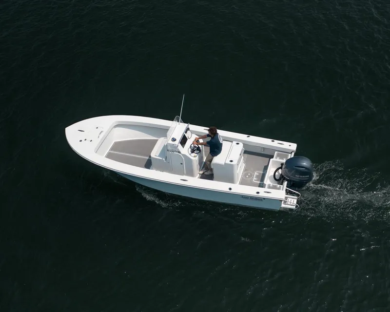 Slide: The Image of 2023 Jones Brothers 23 Cape Fisherman boat cruising on open water. - 30