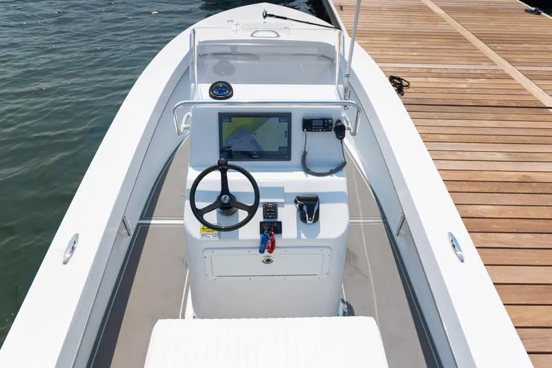 Slide: The Image of 2023 Jones Brothers 23 Cape Fisherman boat dashboard at dock. - 7