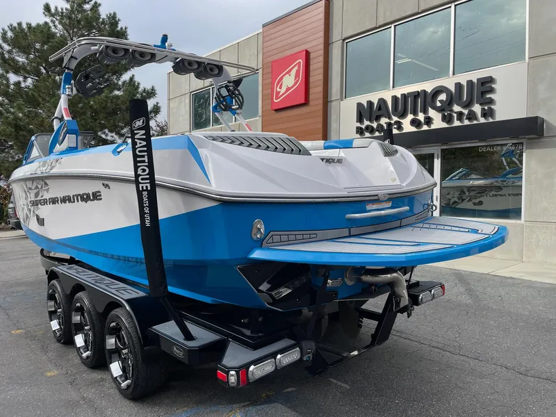 Slide: The Image of 2015 Nautique Super Air Nautique G25 boat displayed outside dealership. - 3