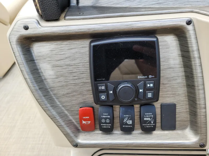 Slide: The Image of Control panel of 2022 Premier 220 Sunspree RF boat with audio and lighting switches. - 10