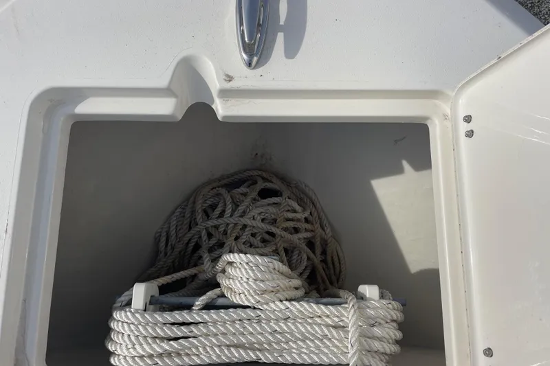Slide: The Image of Rope storage compartment on 2022 Cobia 220 Center Console boat. - 14