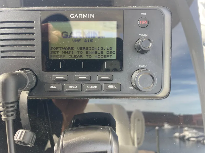 Slide: The Image of Garmin VHF 215 radio on 2022 Cobia 220 Center Console boat. - 5