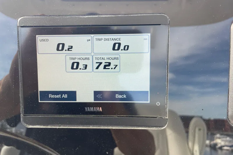 Slide: The Image of Yamaha display on 2022 Cobia 220 Center Console showing trip and total hours. - 6