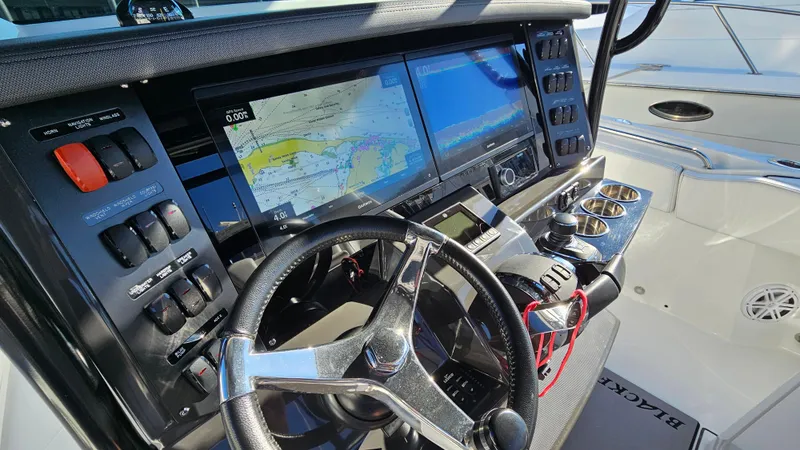 Slide: The Image of Blackfin 332 CC 2021 boat dashboard with navigation screens and controls. - 22