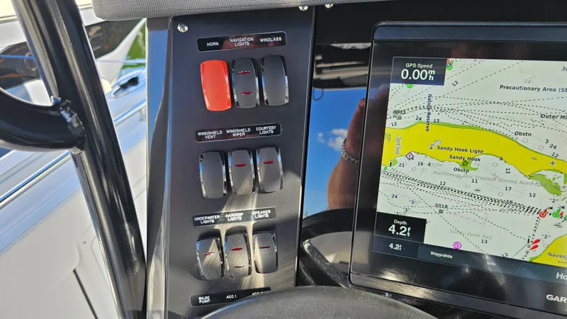 Slide: The Image of Control panel and GPS display on 2021 Blackfin 332 CC boat. - 23
