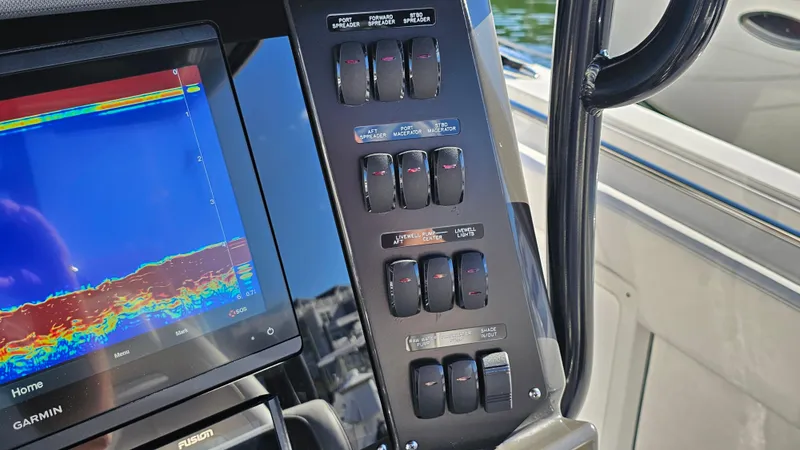 Slide: The Image of Control panel and display on a 2021 Blackfin 332 CC boat. - 24