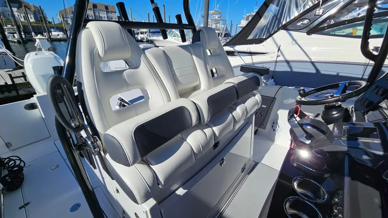 Slide: The Image of 2021 Blackfin 332 CC boat interior with modern seating and steering console. - 27