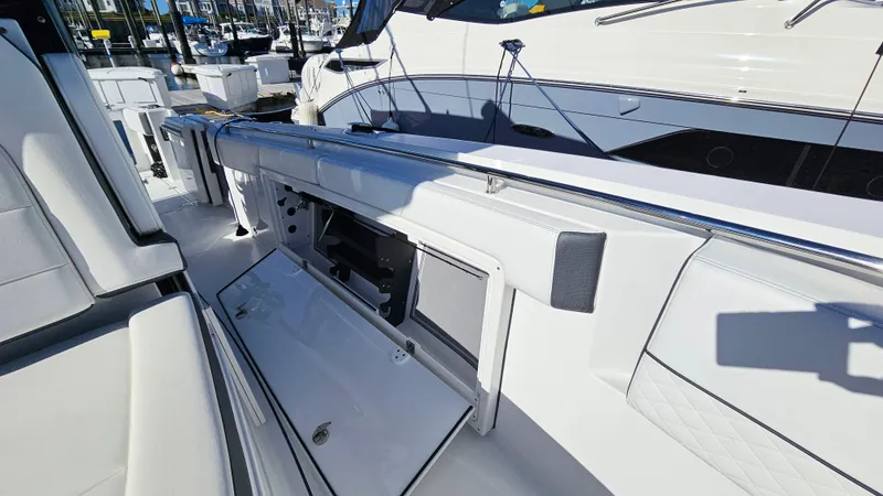 Slide: The Image of 2021 Blackfin 332 CC boat interior with open storage compartment. - 33