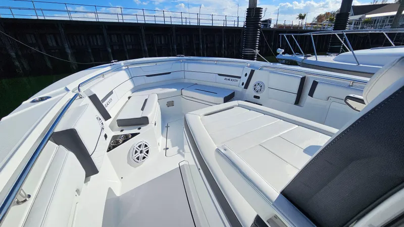 Slide: The Image of 2021 Blackfin 332 CC boat interior with white seating and modern design. - 35