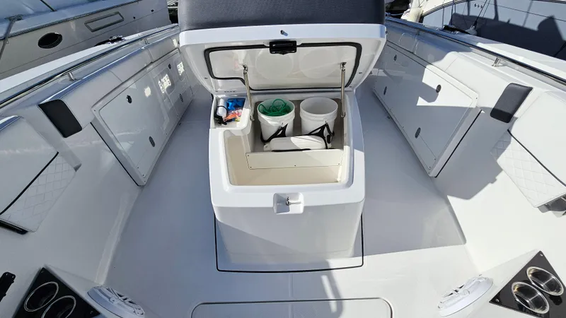 Slide: The Image of 2021 Blackfin 332 CC boat interior with open storage compartment. - 36