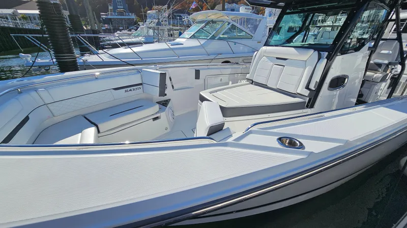 Slide: The Image of 2021 Blackfin 332 CC boat interior with white seating and sleek design. - 38