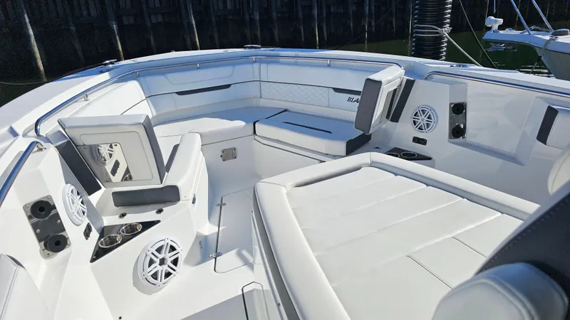 Slide: The Image of 2021 Blackfin 332 CC boat interior with white seating and modern amenities. - 39