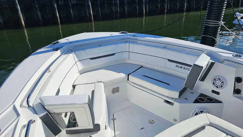 Slide: The Image of 2021 Blackfin 332 CC boat interior with white seating and modern design. - 40