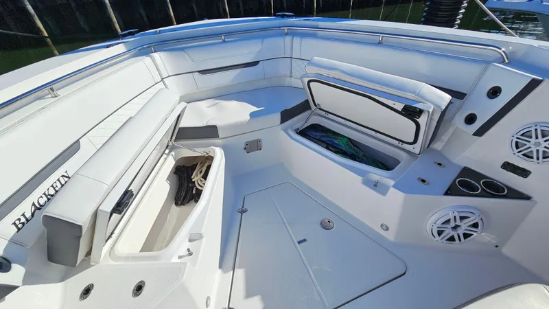 Slide: The Image of 2021 Blackfin 332 CC boat interior with storage compartments and seating. - 41