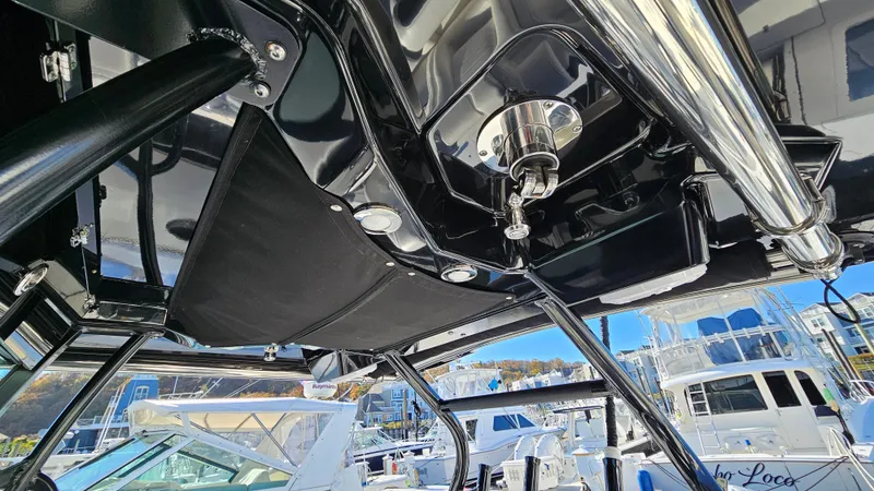 Slide: The Image of Interior view of 2021 Blackfin 332 CC boat, showcasing sleek design and marina background. - 46