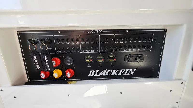 Slide: The Image of Control panel of 2021 Blackfin 332 CC boat with switches and labels. - 49