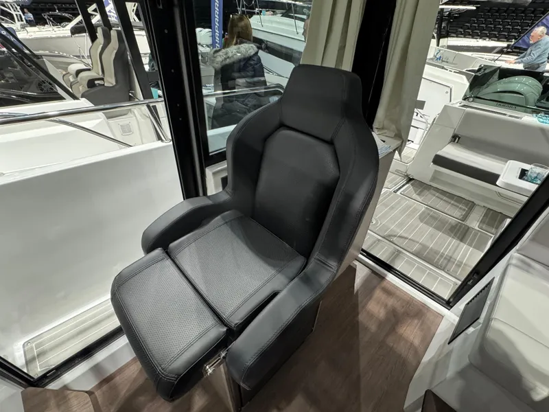 Slide: The Image of 2025 Jeanneau NC 895 Sport Series 2 interior seat, modern design, black upholstery. - 14