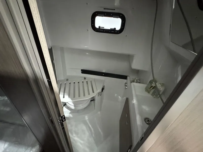 Slide: The Image of 2025 Jeanneau NC 895 Sport Series 2 bathroom with compact design and modern fixtures. - 18
