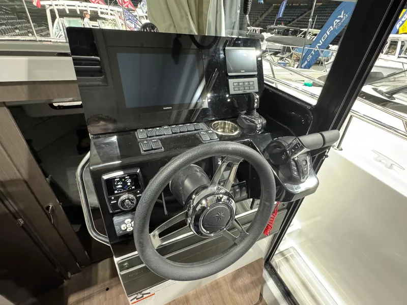 Slide: The Image of 2025 Jeanneau NC 895 Sport Series 2 helm with modern controls and navigation system. - 9