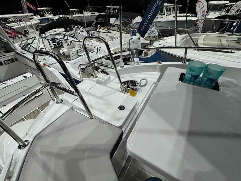 Slide: The Image of 2025 Jeanneau NC 895 Sport Series 2 boat deck with seating and railing. - 29
