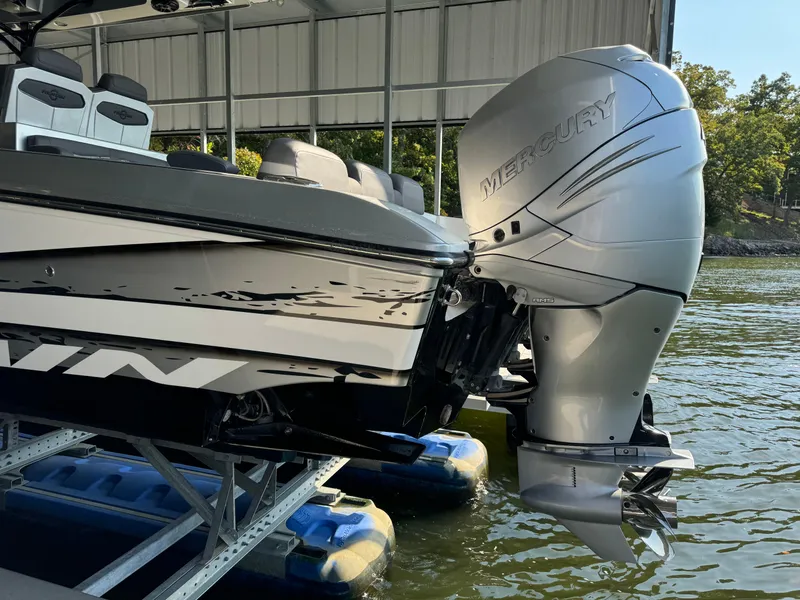 Slide: The Image of 2022 Fountain 38 SC boat with Mercury outboard engine on a dock. - 5