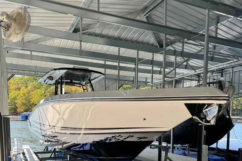 Slide: The Image of 2022 Fountain 38 SC boat docked in covered marina. - 9